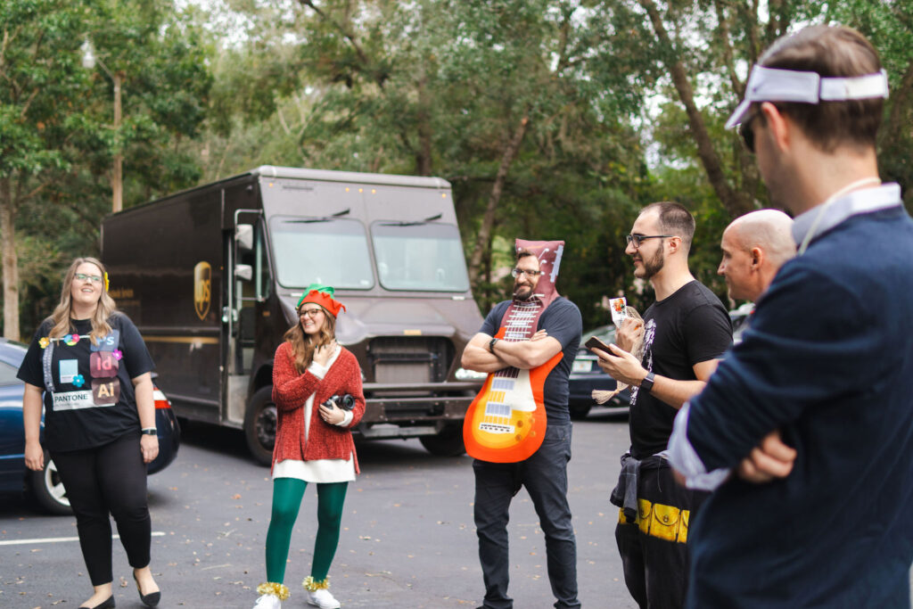 culture - photo of the PHOS Creative staff in a parking lot with costumes on